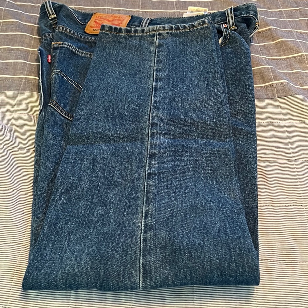 New without tags. Levi’s 550 Blue jeans related with tapered leg.